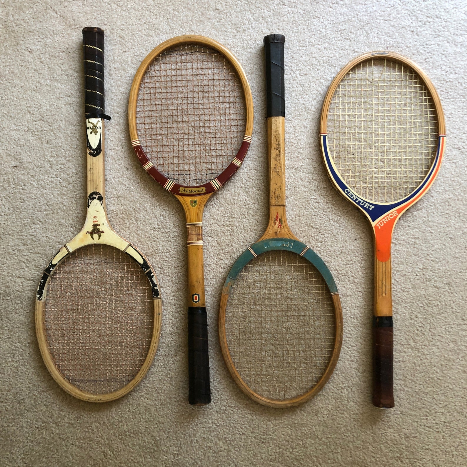 four vintage tennis racquets