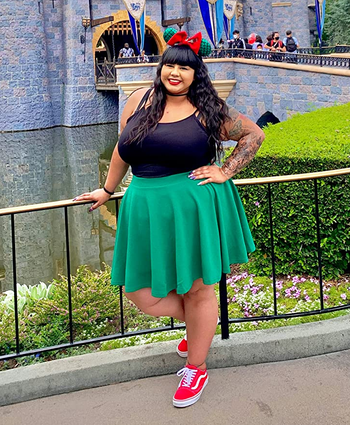 image of reviewer wearing the green skater skirt