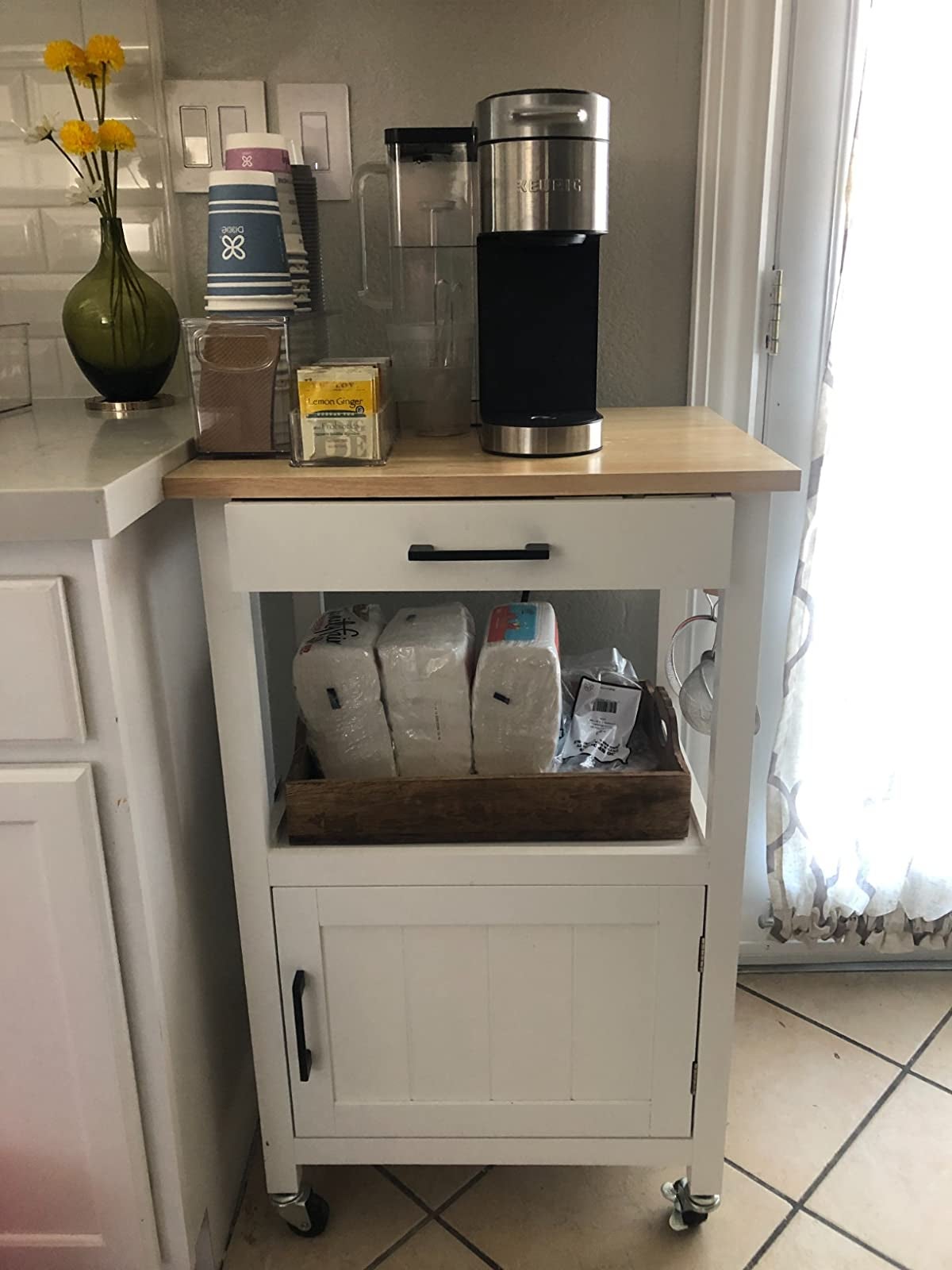 reviewer image of the white kitchen cart in a kitchen