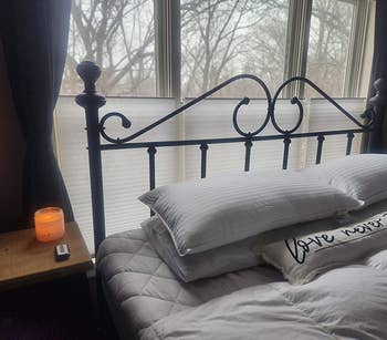 reviewer photo of the pillows on a bed