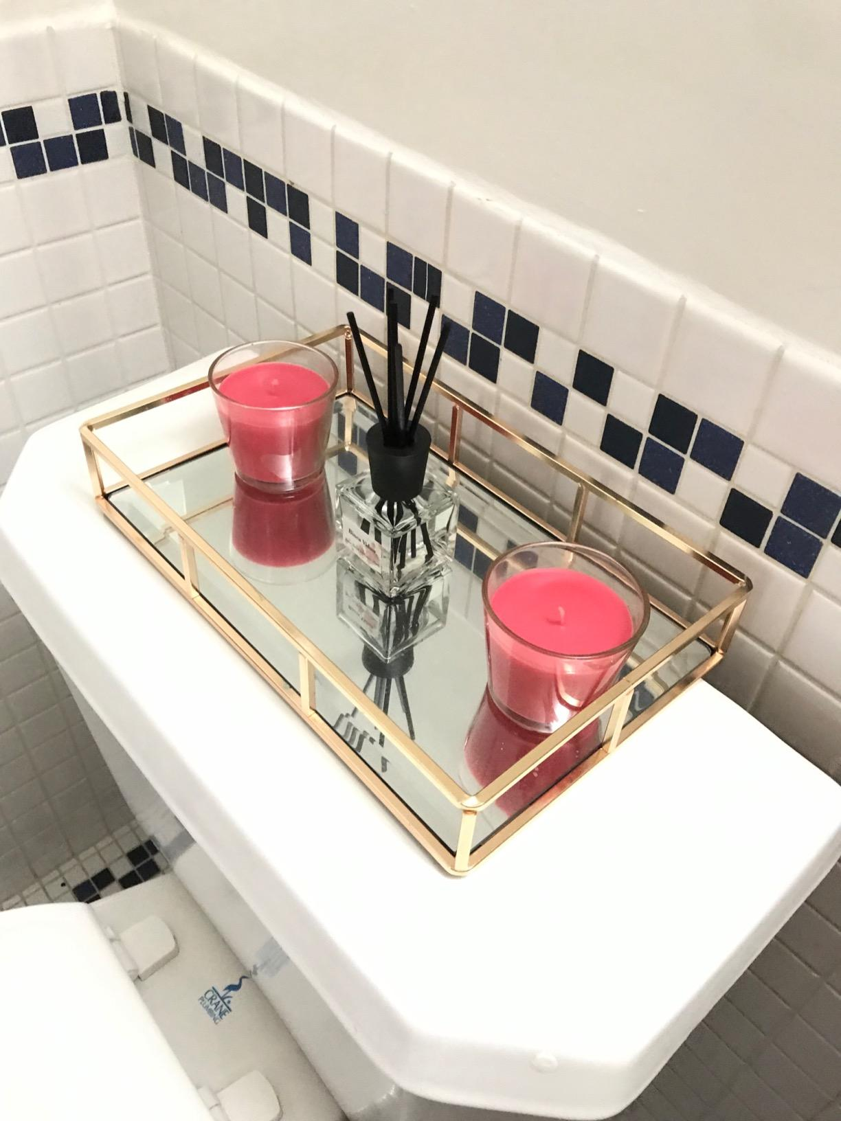 another reviewer's mirrored tray connected  a toilet vessel  with 2  candles and a diffuser, perfect  for a stylish bath  decor setup