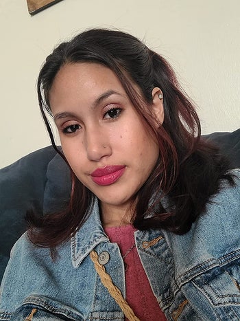 Reviewer wearing fuschia matte lipstick