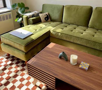close up of the green couch in a living room