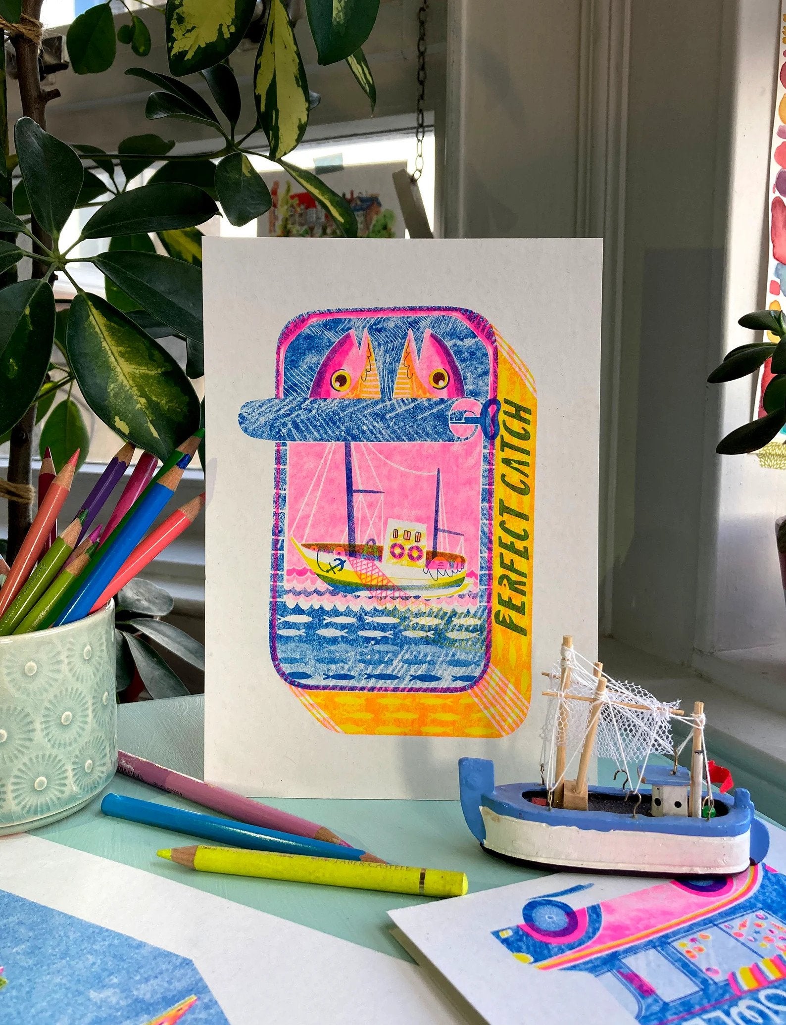 colorful print of sardines in a tin
