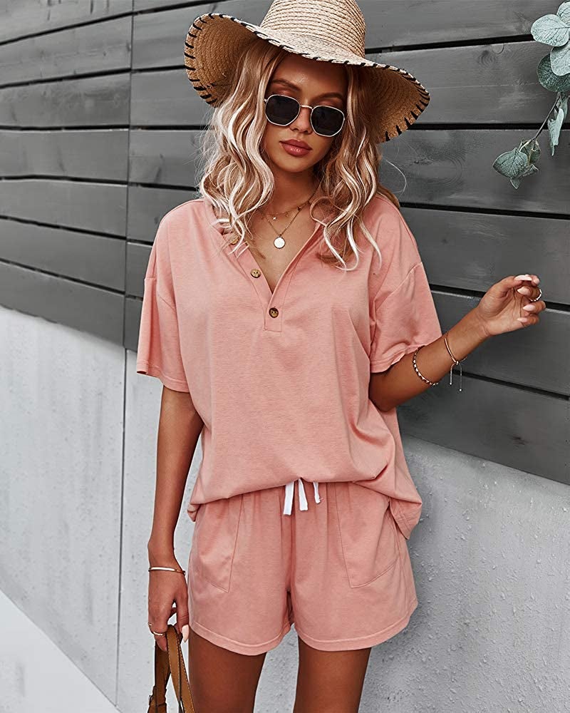 model in matching pink button T-shirt and shorts set