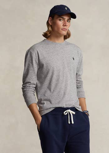 model posing wearing long-sleeve grey Polo t-shirt