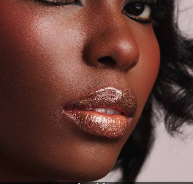 a model with shimmery lip gloss on