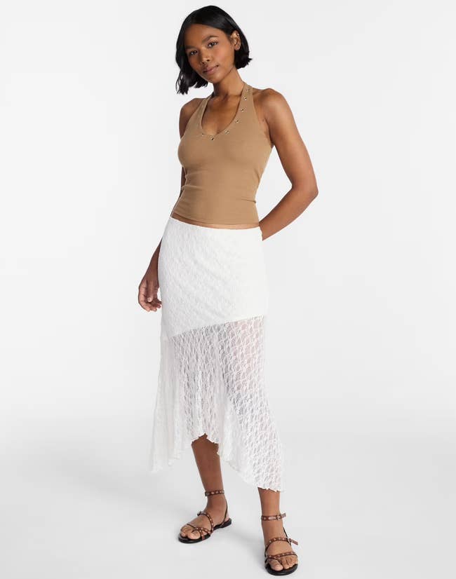 A exemplary successful a sleeveless apical and achromatic lace skirt