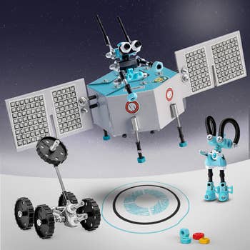 Three different light blue buildable robot characters