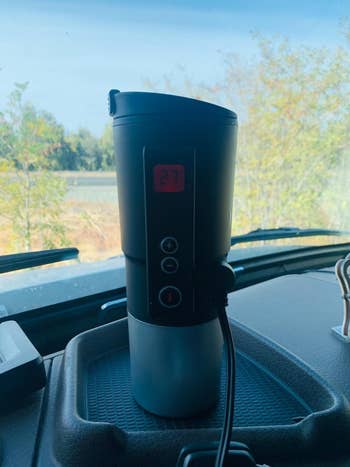 A reviewer's electric tumbler in their car