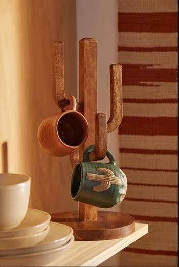 lifestyle image, cactus mug holder on a shelf