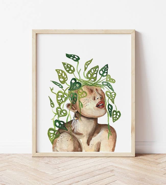 A close up of the print of a person  with plants coming out of their head