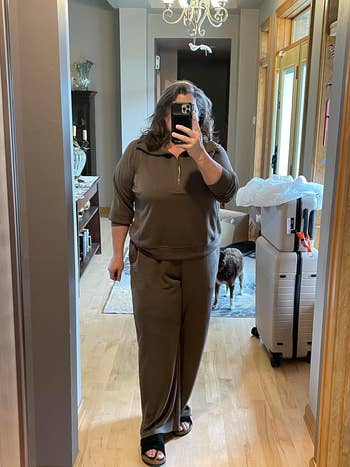 reviewer wearing brown tracksuit