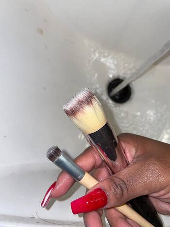 an after image of the two makeup brushes now clean