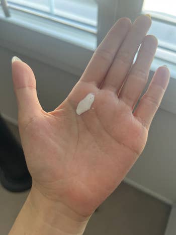 BuzzFeed-er showing what the sunscreen looks like on their hand