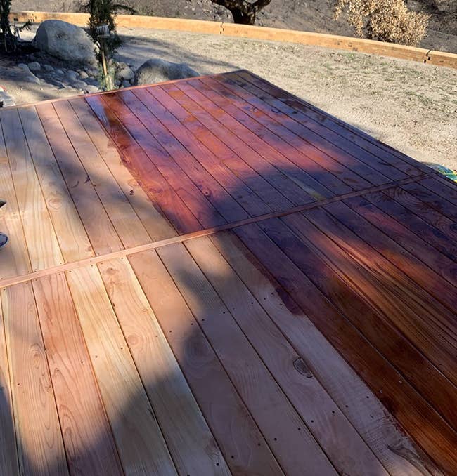 reviewer image of deck half stained, with the half-stained side vibrant and bright