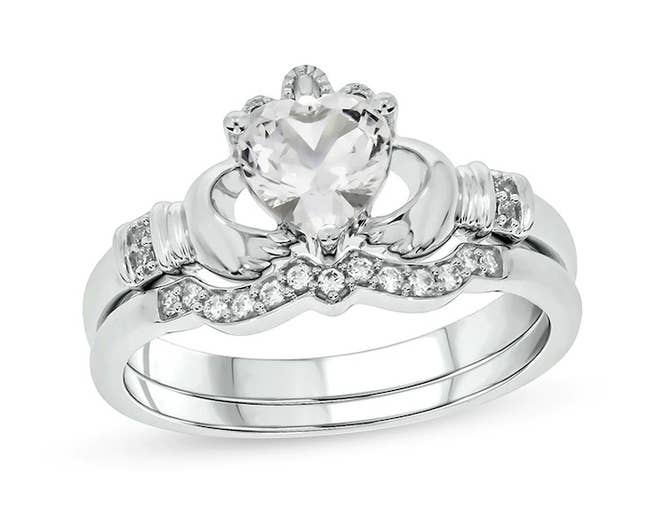 the claddagh ring set with a diamond heart in the center 