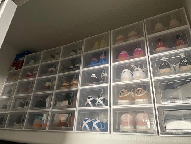 Stacked wide footwear boxes showcasing assorted sneakers, neatly organized for casual access, illustrating a stylish and applicable retention solution