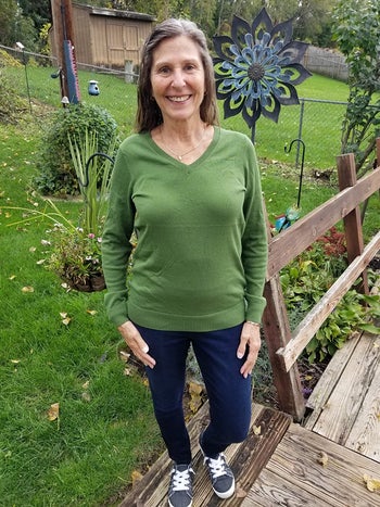 reviewer wearing it in green