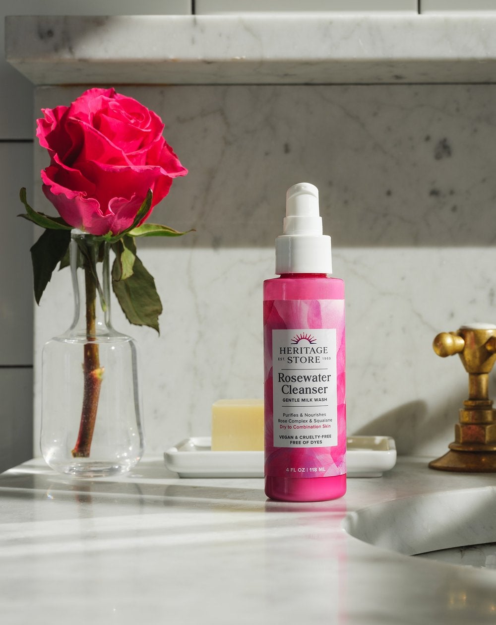a pink bottle of rosewater cleanser
