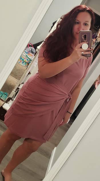 reviewer wearing the mauve dress