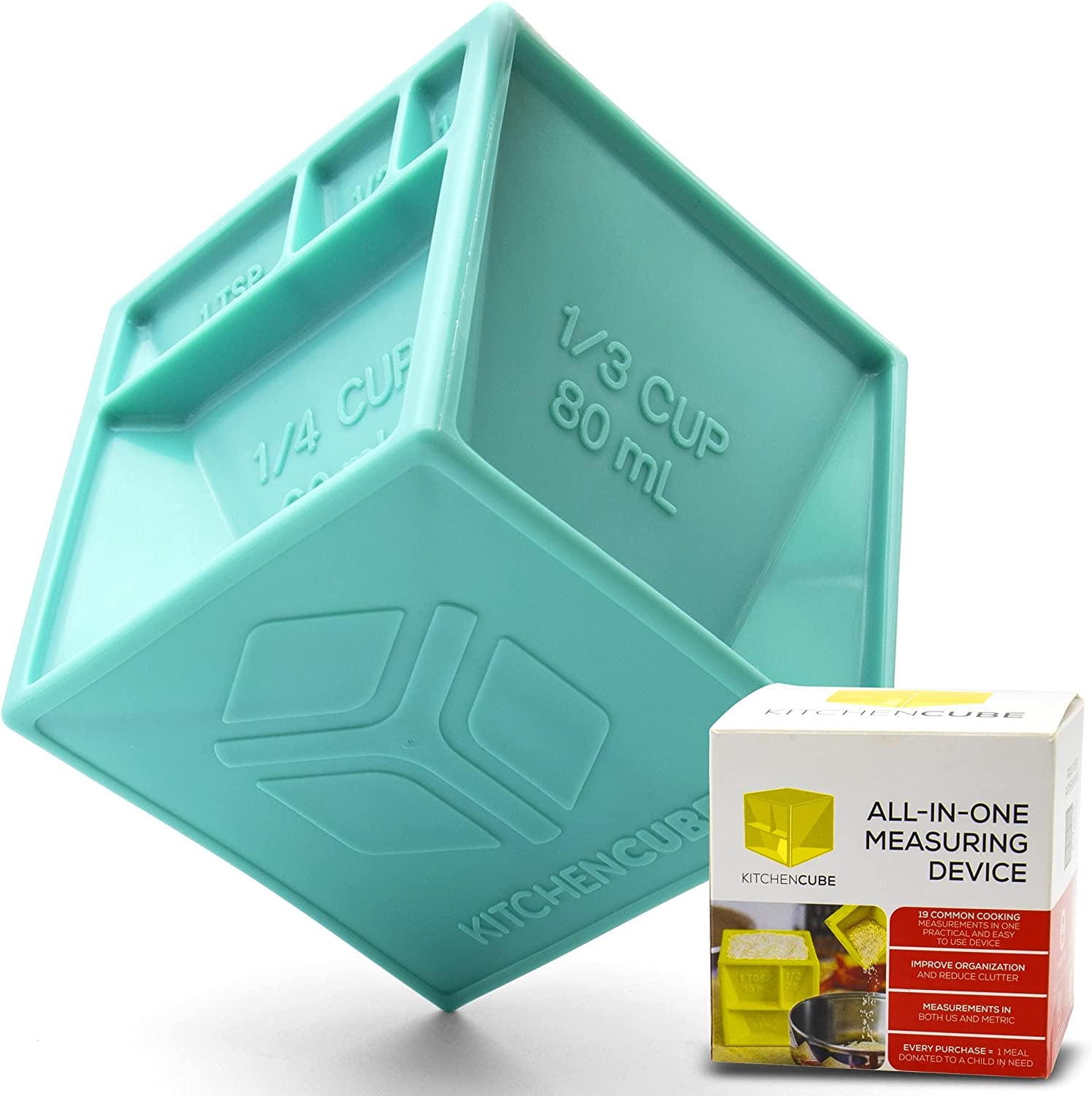 the teal kitchen cube, which has different measurements on each of its sides, next to its box