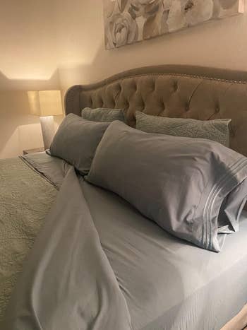 another reviewer's bed made with the gray sheet set