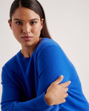 model wearing the sweater in bright blue