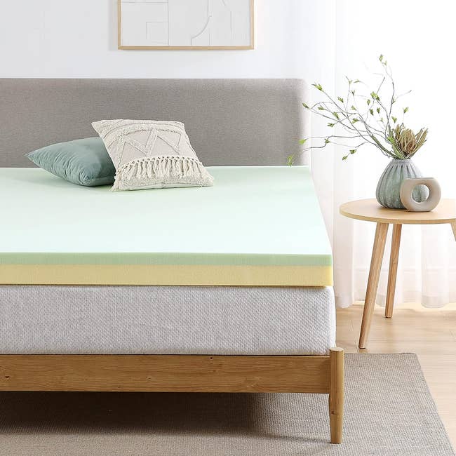 the light green topper on a mattress