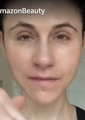 Person applying facial cream, demonstrating a beauty product on clear skin for a shopping article