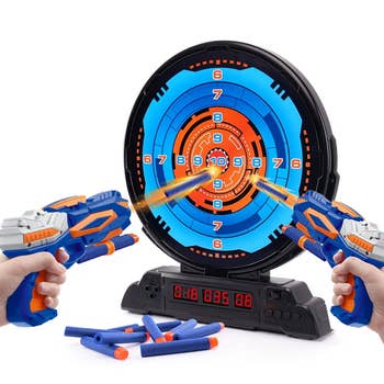 the Nerf blasters shooting at the target