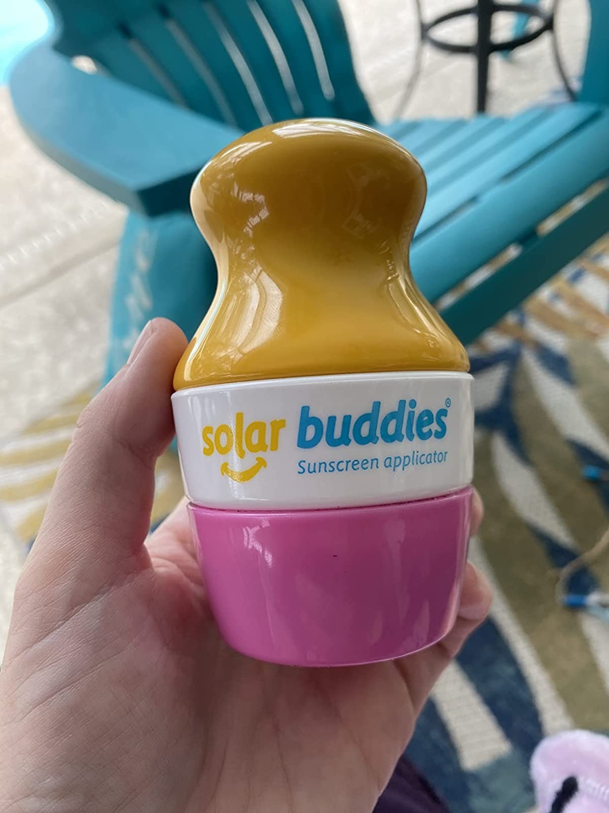 a reviewer holding the applicator with the lid on 