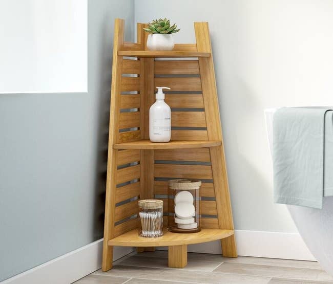 Wooden country support with plant, soap dispenser, and decorative jars successful a minimalist bathroom