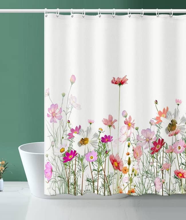 Floral shower curtain with a variety of wildflowers design