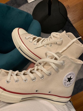 reviewer image of the converse shoes in off-white