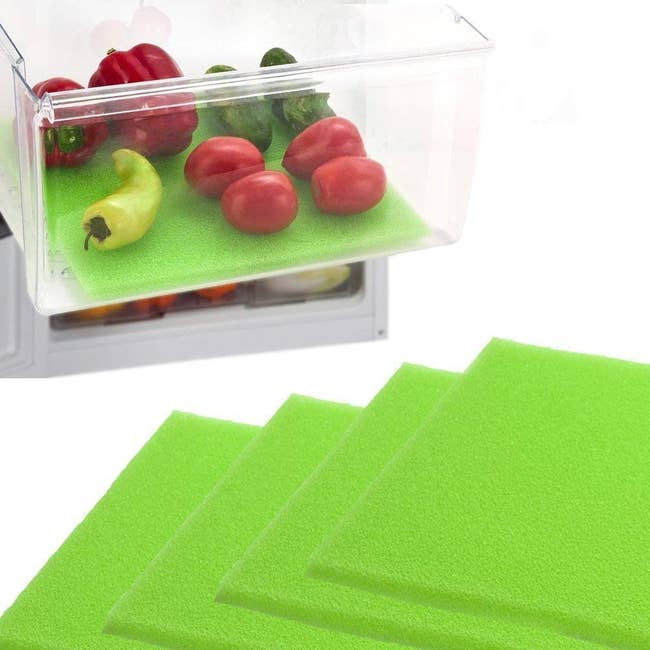 the green foam liners in a drawer with peppers, cucumbers, and tomatoes