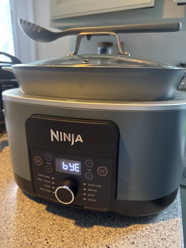 Ninja multi-cooker displayed connected  a room  counter, showcasing assorted  cooking modes similar  dilatory  cook, sear, and cook  connected  the power  panel