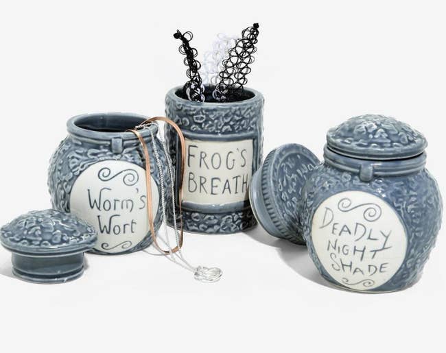 worm's wort, frog's breath, and deadly night shade ceramic jars 