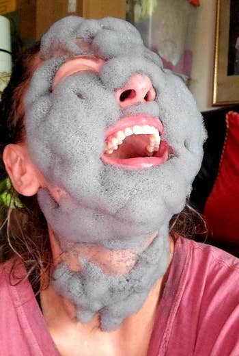 Person laughing with a bubbly look   disguise  applied, wearing a casual shirt