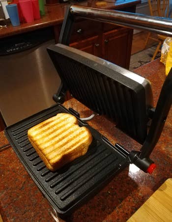 Reviewer image of toasted sandwich on black grill
