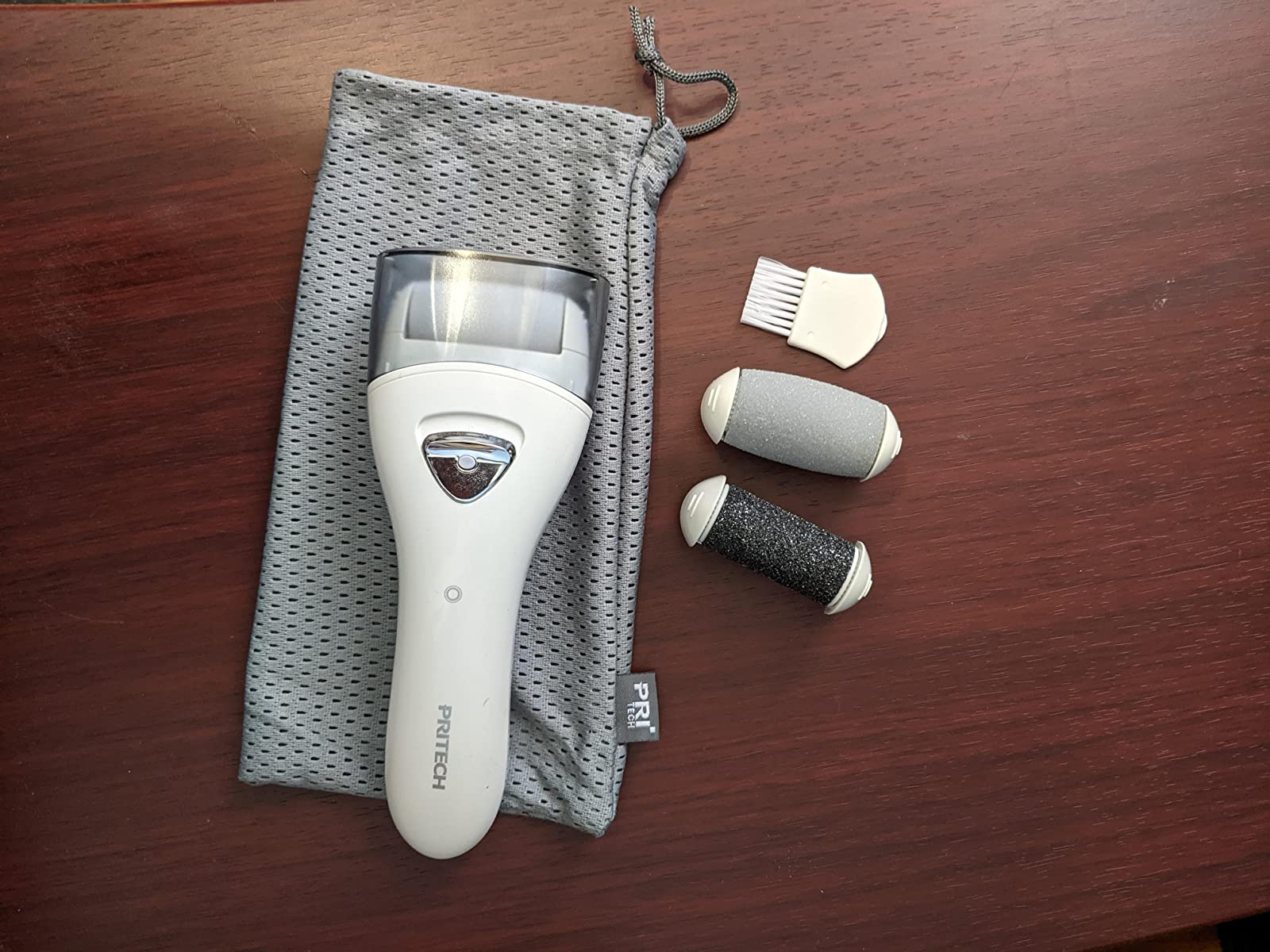 a reviewer photo of the electric callus remover with replacement cartridges 