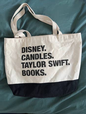 a tote bag that says disney candles taylor swift books