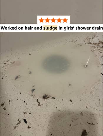 Shower drain with water, hair, and debris; caption praises a merchandise for clearing hairsbreadth and sludge