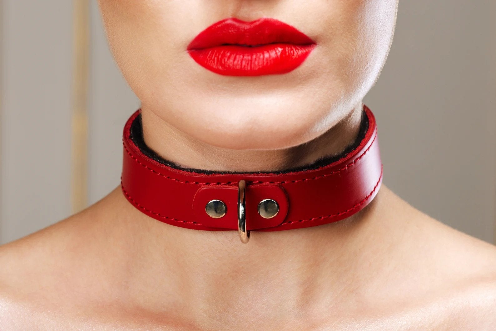 Model wearing red leather collar