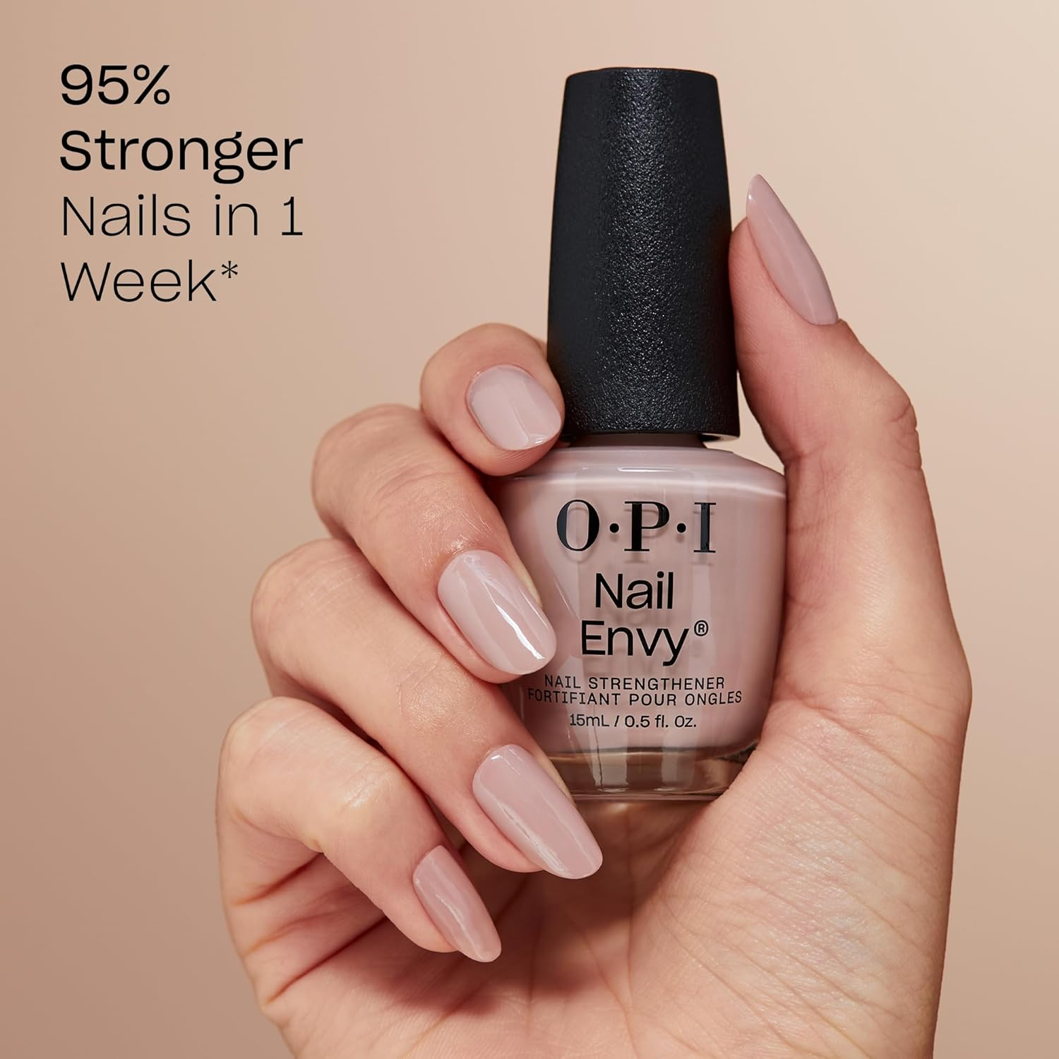 Hand holding OPI Nail Envy bottle, showcasing polished nails with text claiming 95% stronger nails in 1 week