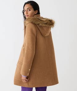 A model wearing the coat in acorn brown