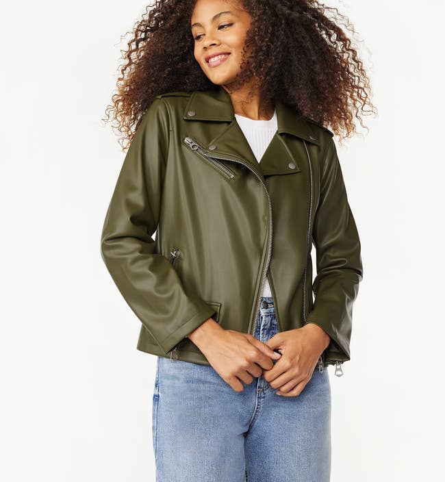 model wearing olive green-colored leather jacket