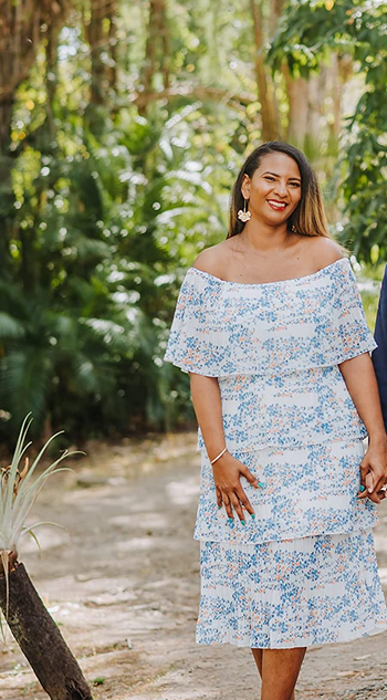 reviewer wearing the dress in a blue and white pattern