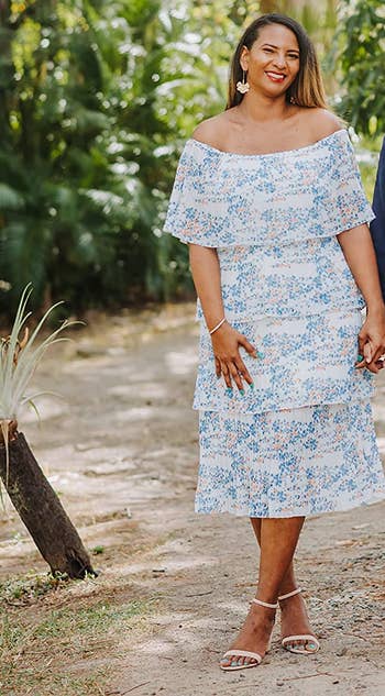 reviewer wearing the dress in a blue and white pattern
