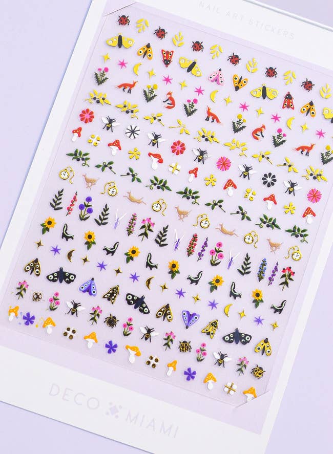 tiny stickers of things like flowers, mushrooms, deer, bugs, clocks and stars